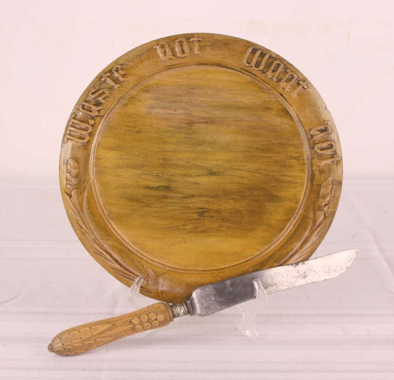 Wonderful for a country meal, all hand-carved. Put a plump round bread on this and it is an eyecatcher. Board shows some use. Very charming. Measurement below is for the breadboard. The knife is 13' long.