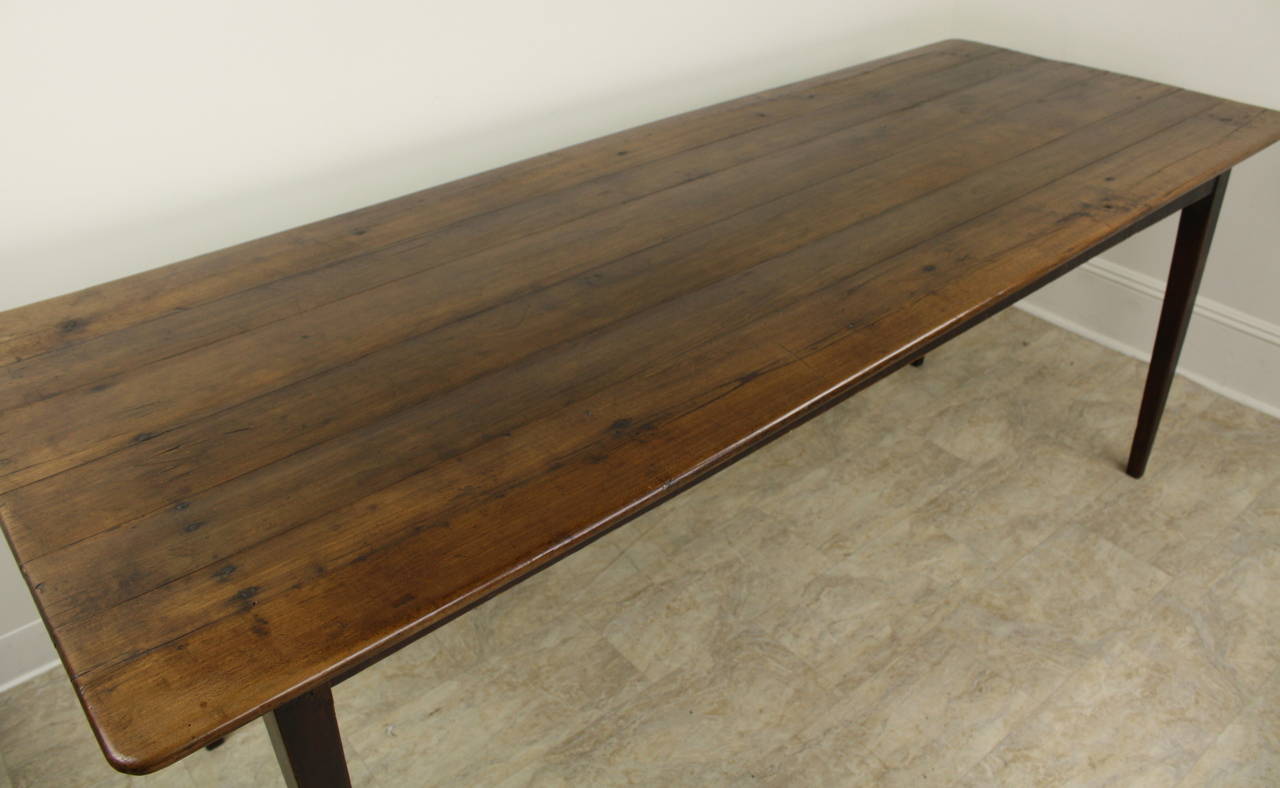 This table has an elegant slender look, highlighted by the long tapered legs. The cherry is a lovely color, with a pretty grain and a good patina.  The apron height is a good 26