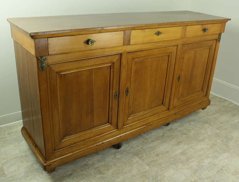 This stunning piece is very elegant, at the same time, simple in the Louis Philippe style.  The lovely cherry color is rich and deep, but remaining light in color.  Three drawers across the top have simple knobs, which are very compatible with the