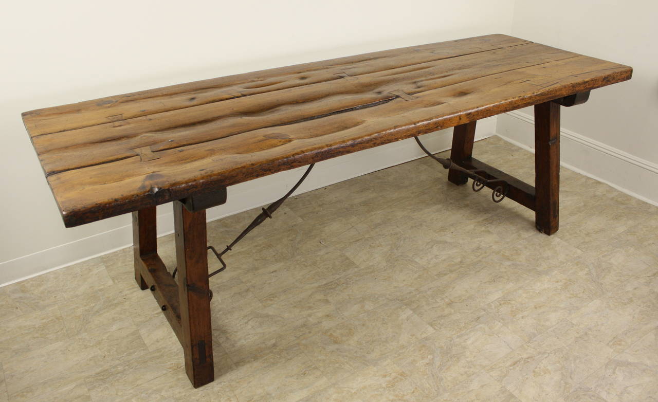 For a fabulous mountain vacation house, or for any country environment that is the best of the best, here is a choice table. Very rustic, and has the look of the ages. The top has been scrubbed repeatedly over the years, right through to the table