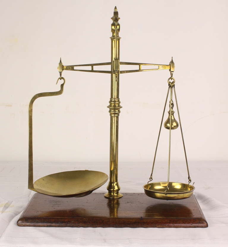Very smart-looking tall measuring scales. Lovely on the sideboard or desk. We will send a nice small set of round weights for display. Elegant and shiny, these can hold anything from nuts to mints--your choice. Made by Avery of Nottingham, a