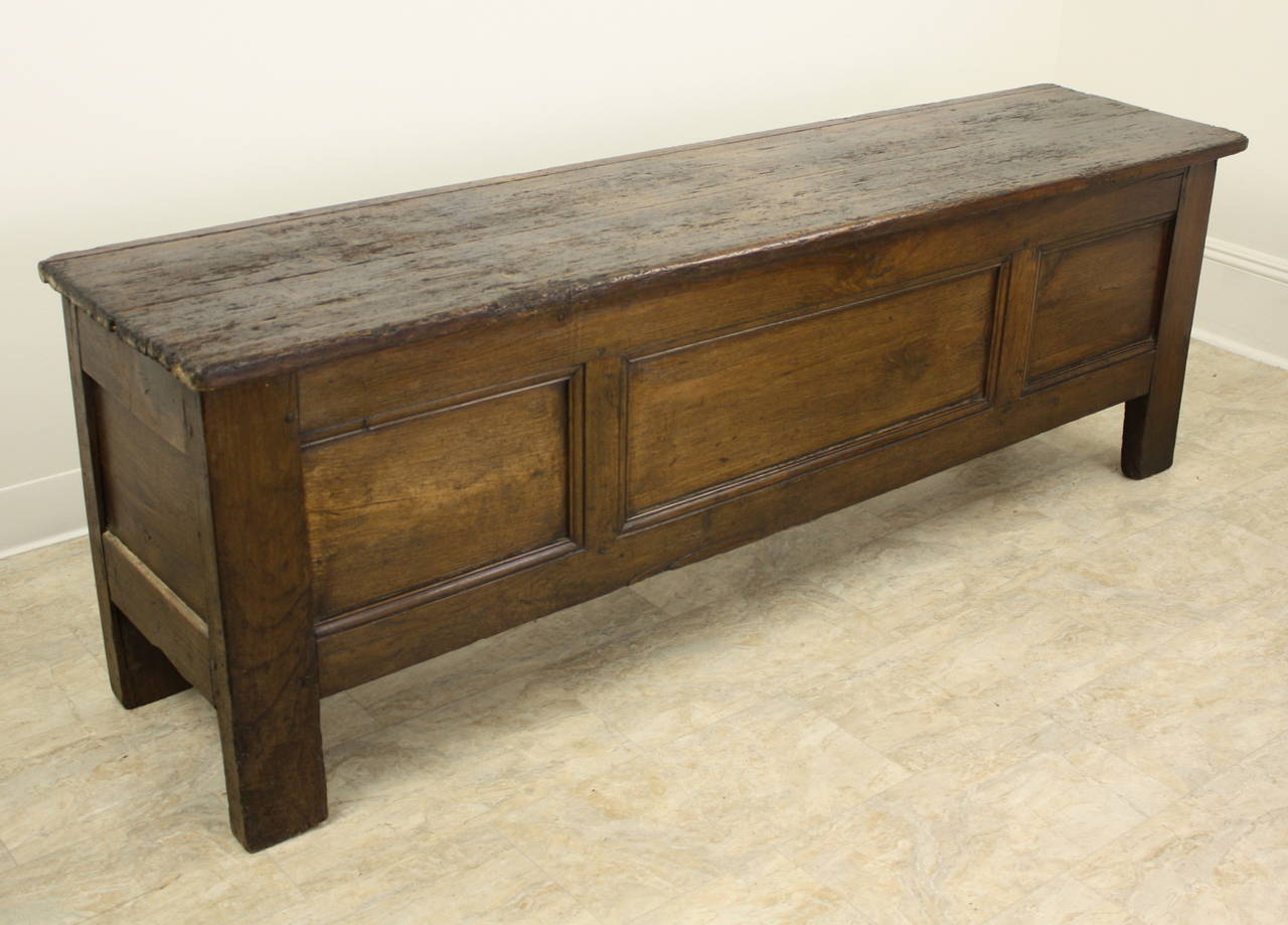This is a terrific multi-purpose piece, to be used at the end of the bed, or up against a wall, as storage and a seat, and sometimes as a long narrow coffee table when there is just a narrow space available in front of a sofa. Lovely patinated