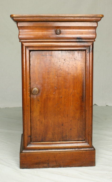 A pretty French cupboard with lovely shaped top and drawer. Warm color, this piece is as attractive as it is useful, with an excellent patina. The cupboard is 9 1/2