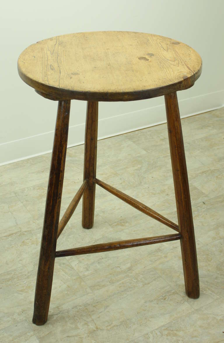 Very charming small Welsh cricket table, Very good height for a side or end table, and also for a lamp table.  A great antique country look, with very lovely shaped stretchers at the base. there is a small knothole and an area of wear in two places