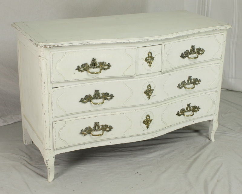 Stunning.  A fabulous slightly-off-white painted Louis XV bureau.  Two-over-three drawer configuration in the classic Rococo style, light and graceful.  The curved front of the piece reflects the aesthetics of the period, in which furnishings were