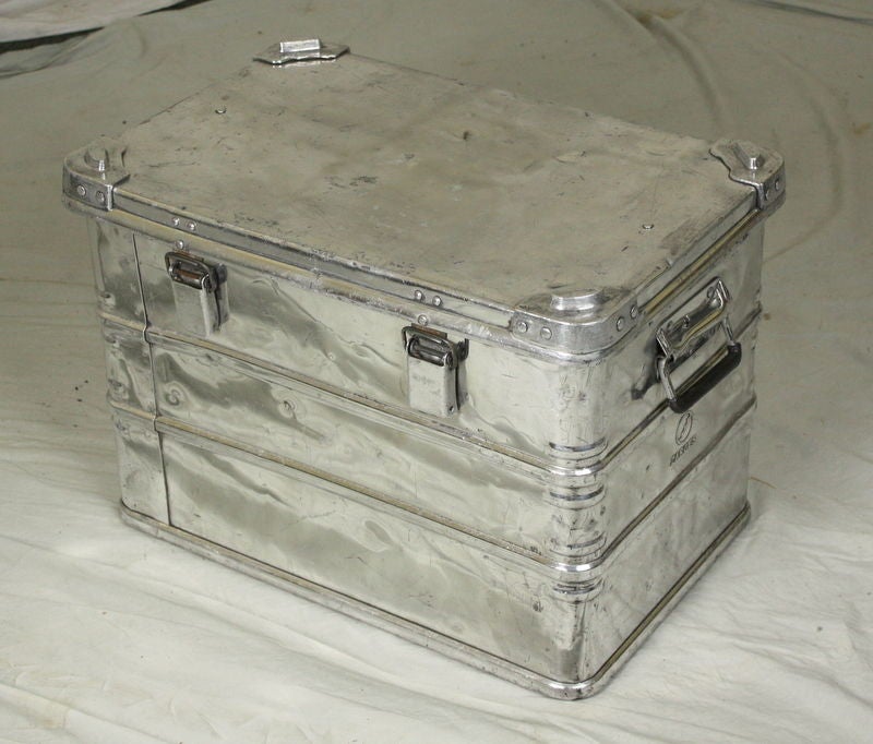 A small polished aluminum trunk from the esteemed German company Zarges, founded in Stuttgart.  Probably originally used in industrial product transport, this trunk has lots of interesting detail, including reinforced riveted corners.  Bright and