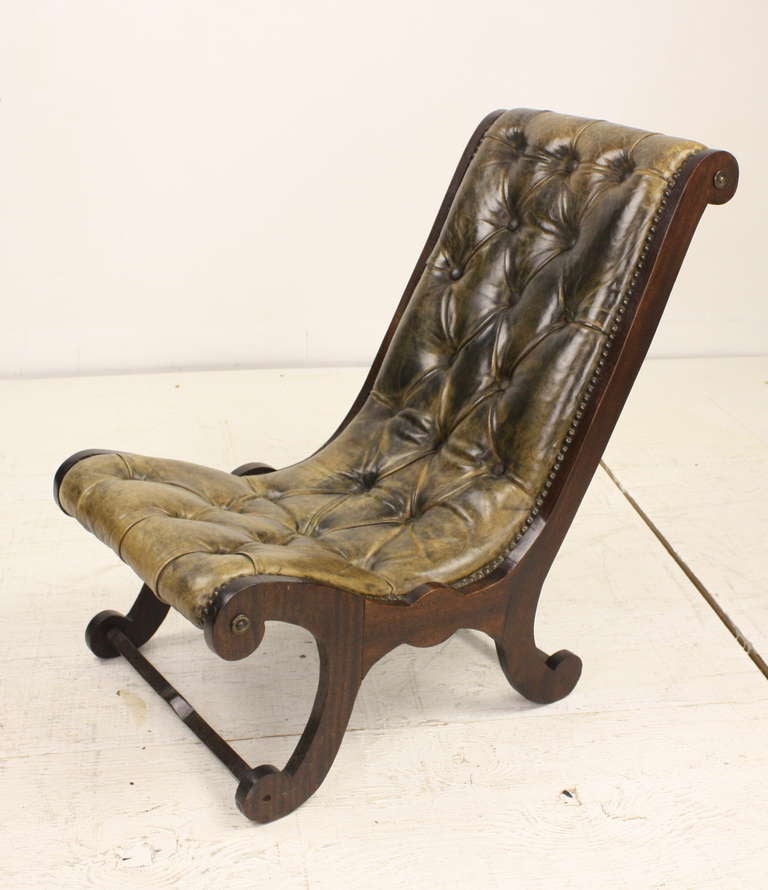 Very charming, miniature version of the Classic Regency chair, mahogany frame, sweet for children. Leather is in good condition, showing some use.