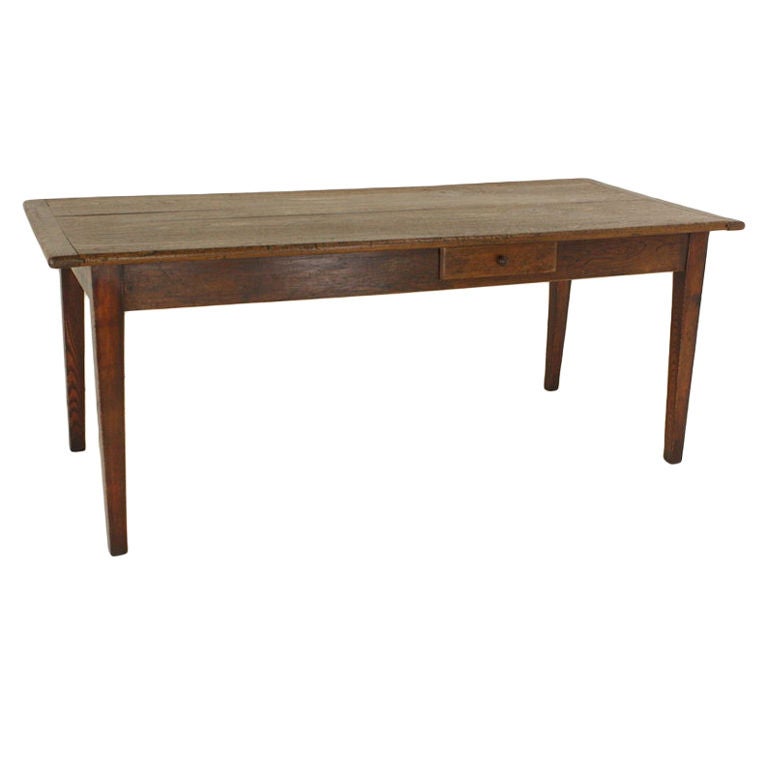 Terrific elm table, beautiful grain, breadboard ends, in a very usable size, good wide depth, with a charming small drawer on one long side.  Classic country tapered legs are replaced, very well done in the traditional look.  Very strong and sturdy.