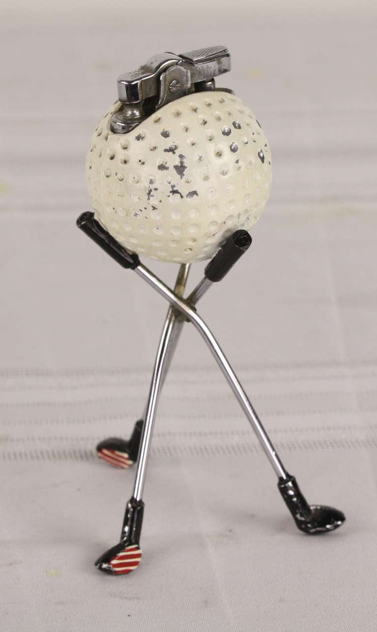 Just add lighter fluid, this is a great gift for the golfer. Red and white stripes on the golf club heads are charming. From England, made Mid-Century.