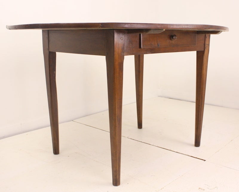 Beautiful warm cherry country breakfast table, one drawer in the long side.  Gently champhered legs add an elegant touch, in the farmhouse style.  Grain and patina are exceptional. Apron height of 24 1/2