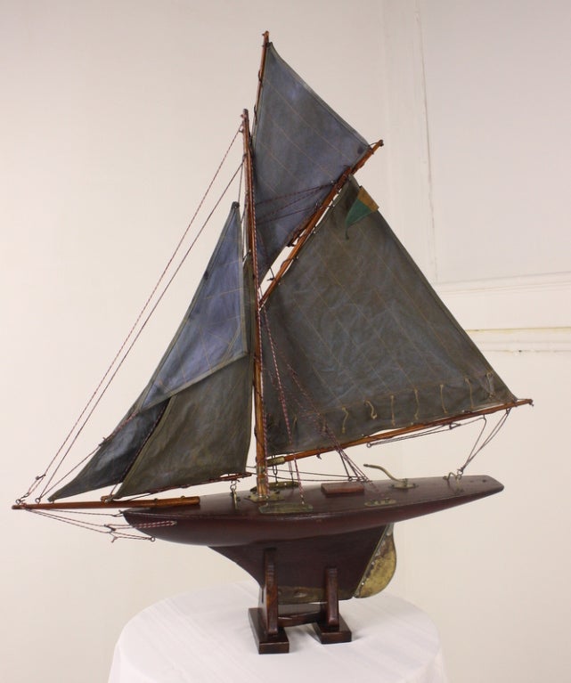 MAKE A DISPLAY WALL OF POND YACHTS!  We have seen this done in a beach house, and it is delightful. SOLD AS A GROUP AT A VERY REDUCED PRICE! Very charming pond yacht models, lovely wood decks and keels, and original brass. Sails have been made from
