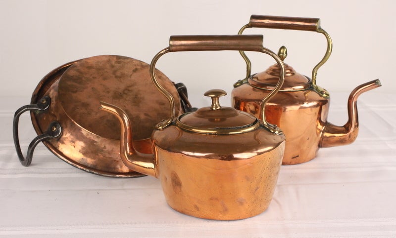 Attractive group of 19th century copper cooking pieces. Makes an attractive display. The measurements below are for the two kettles. The cooking pan measures 13 1/2