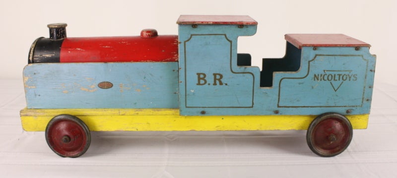 Charming collection of vintage wooden toys from England The big blue British Rail engine is from Nicol Toys, an early wooden toy company in Robertsbridge Sussex, England. Great for display in the bookcase of a grown-up toy lover. Probably lead paint