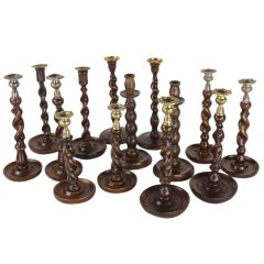 Collection of Seven Pairs of Antique English Oak Candlesticks