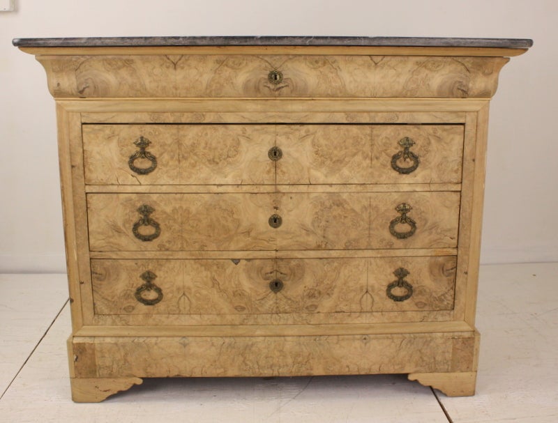 Bleached walnut burl veneer is a popular trend on the rise in French and English decorating. We are starting to see the a similar bureau in fine decorative shops on our buying trips. Classic Directoire handles which are very compatible with the