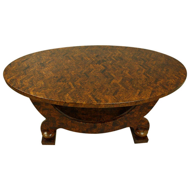 Stunning.  The zig-zag marquetry pattern features many wood specimens in an intricately arranged, light and dark play of style and drama. The burr yew is particularly lovely. The beautifully shaped base is classic Deco and features the