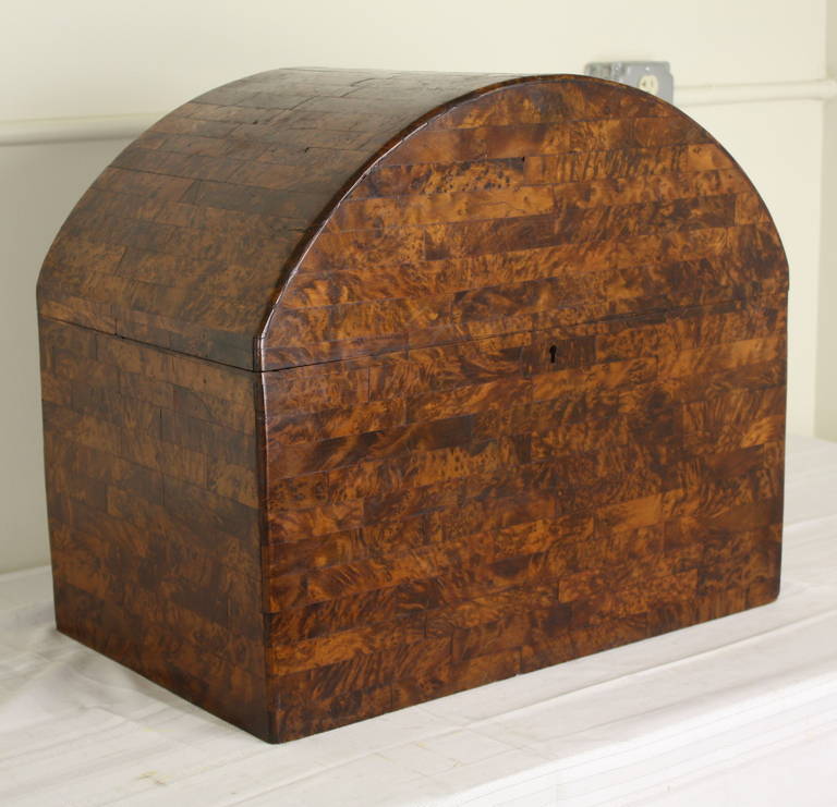 Practical size for holding papers or some firewood, but most notable for the very fine marquetry work, and the color and patina.  Very attractive piece for storage. Any minor losses are really not noticeable. This trunk partners with a Deco coffee