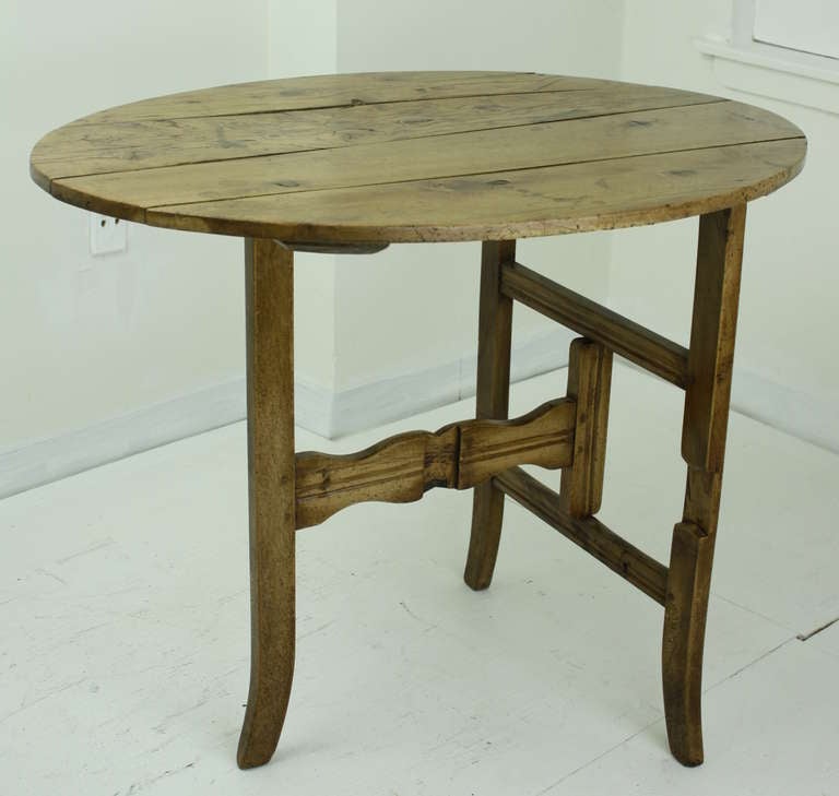 So charming.  The table is the right height for a little tea table, It folds up flat (image 6). The patina is lovely, shows its age, but in a warm, loving way.  The legs are shaped with scallops and curves.  There is a hook to hold the legs flat to