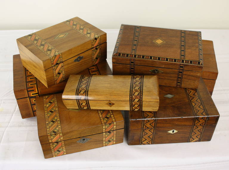 Victorian inlaid boxes for jewelry, letters or small collections, or whatever the owner wishes. The impact of the collecton of boxes on a bookcase or shelf is tremendous.  Great desk accessory.
Measurement below is for the largest box.
The larger