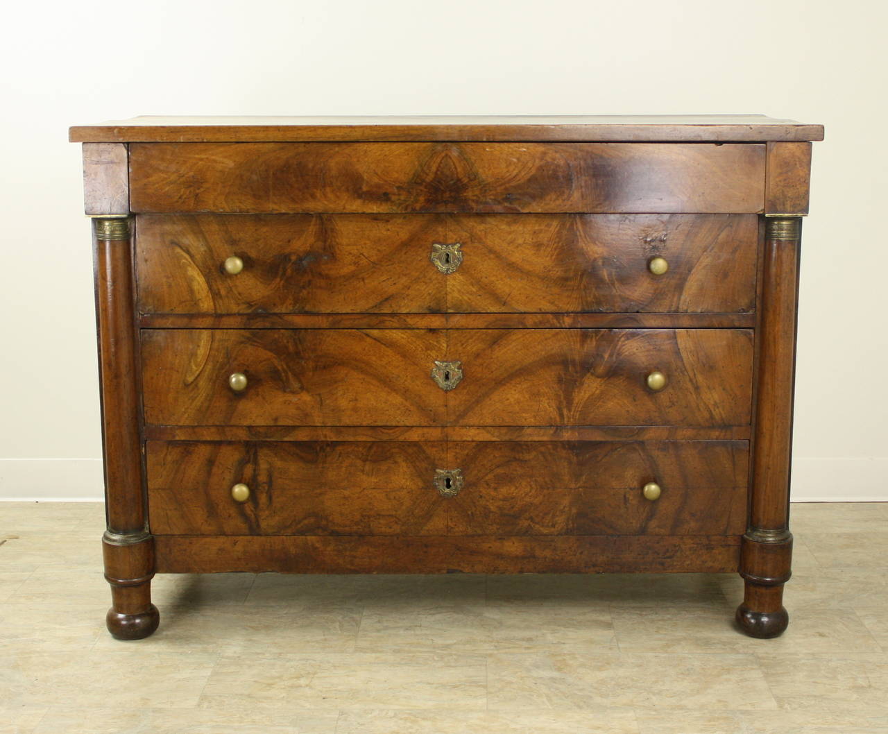 Very classical dramatic French period bureau. Beautiful bookmatched veneer in a warm well-grained walnut. The wood top has a very attractive look. Formal, but with the wooden top, it is suitable for a well-decorated home, and is not over-the-top in