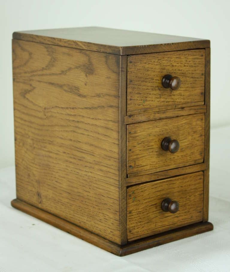 Very practical dresser-top box with drawers, Holds all the jewelry and cuff-links one might have.  Nice antique item lending lots of character. A good gift.