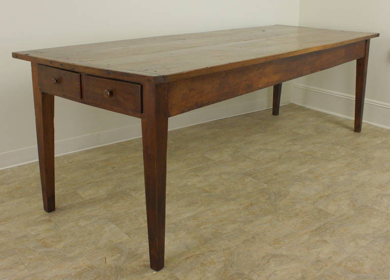 An excellent country dining table in every way. Beautiful warm cherry, with breadboard ends, and drawers on each end.  On one end, a very unusual configuration... two drawers on the same end!  And one larger drawer on the other end, which is the