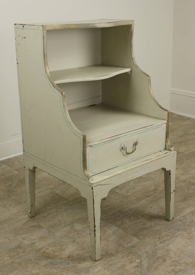 Charming, absolutely classic-lined Georgian cupboard or night stand.  This has been painted but not recently.  It has dull gold edging on the very pale-white, with small defining lines particularly on the top-this is often seen on Regency pieces.