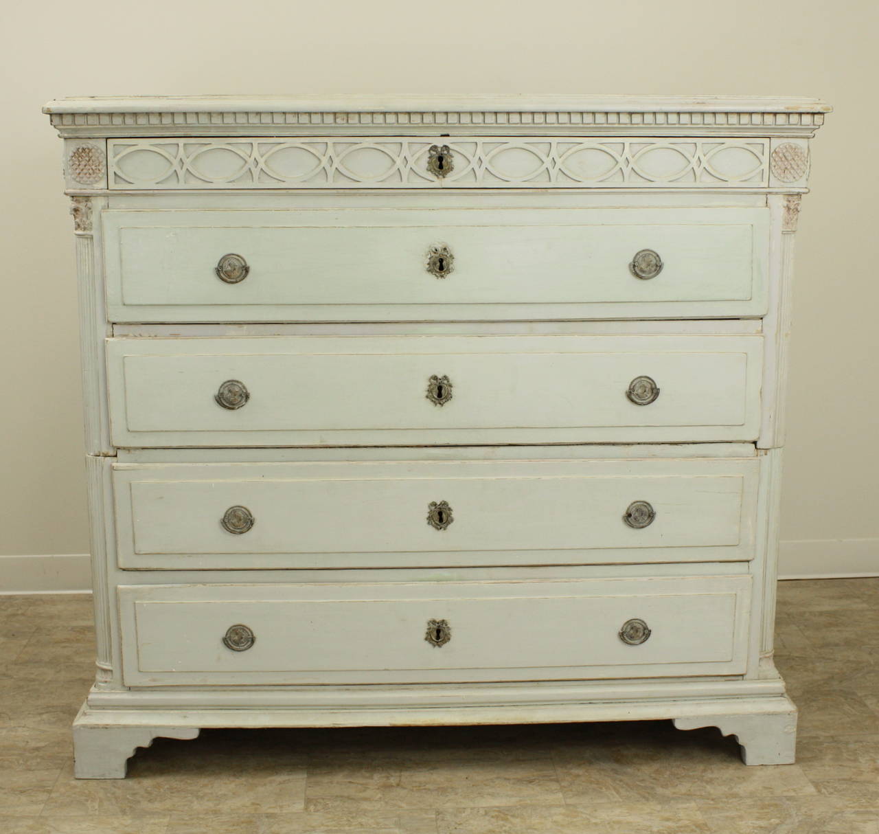 Excellent example of the Swedish commode, the best carved elements enhance this piece.  Beautiful fretwork and dental molding, carved rosettes at the top, lovely carved columns.  Shaped drawers add dimension. All hardware is original bronze. The