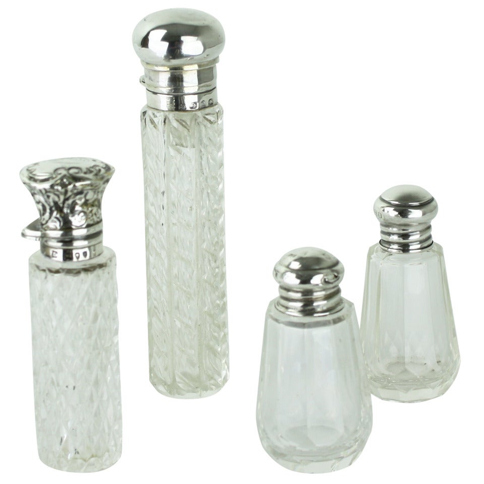 Collection of Four English Hallmarked Silver and Crystal Scent Bottles