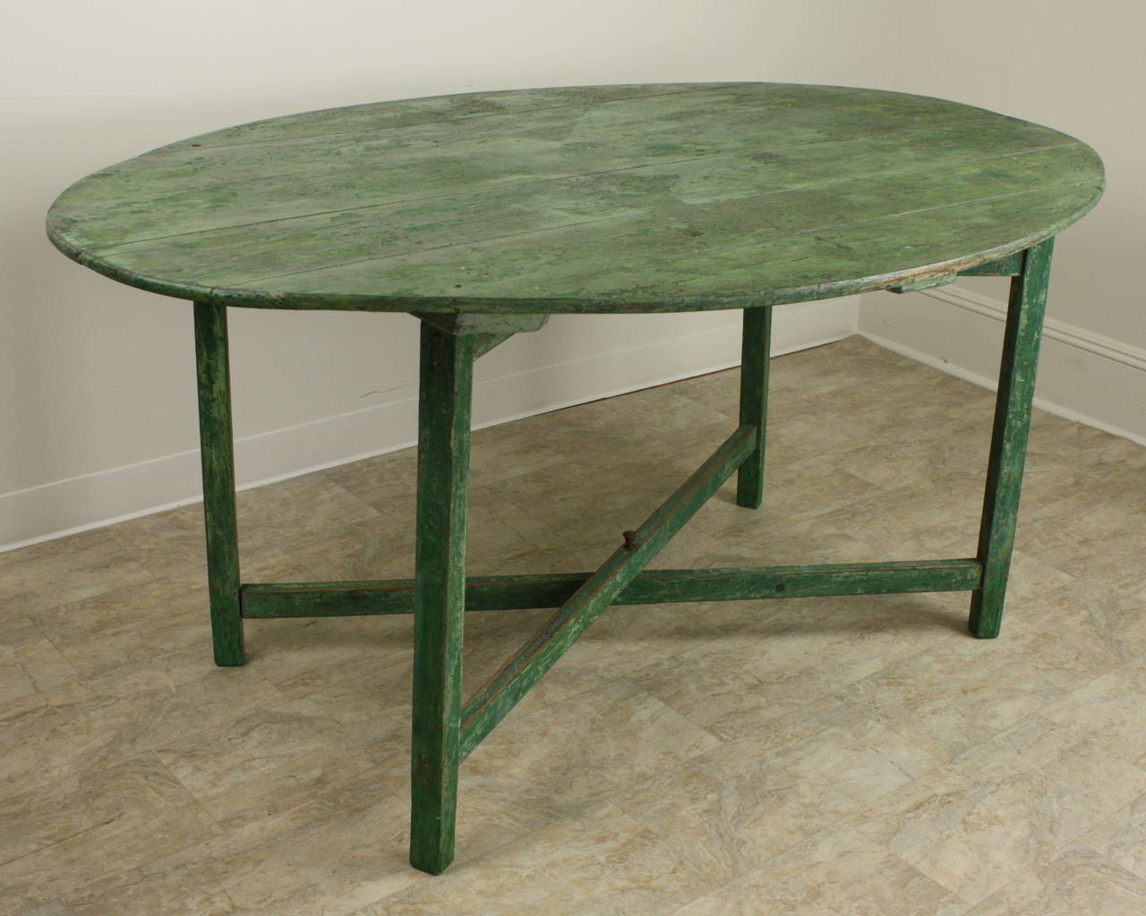 Delightful, lots of old green paint still showing, this oval table is for an upscale country house, makes a great breakfast or lunch table, good-looking farm table base at 67