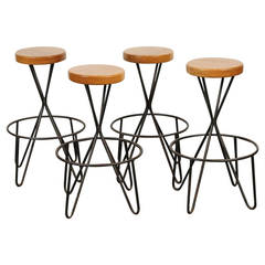 Set of 4 wrought iron and oak barstools by Paul Tuttle.