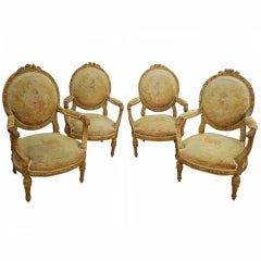 Set of four french gilded wood & nedllepoint Louis XVI Style Fauteuils