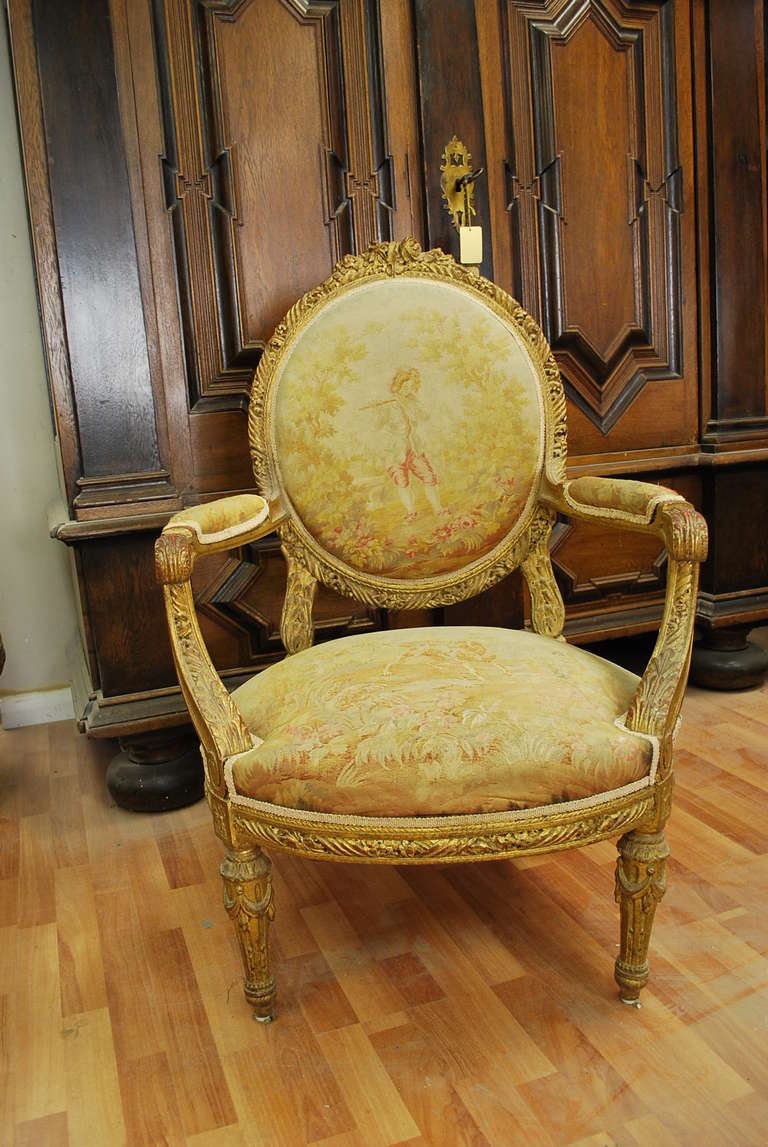 Carved Set of four french gilded wood & nedllepoint Louis XVI Style Fauteuils
