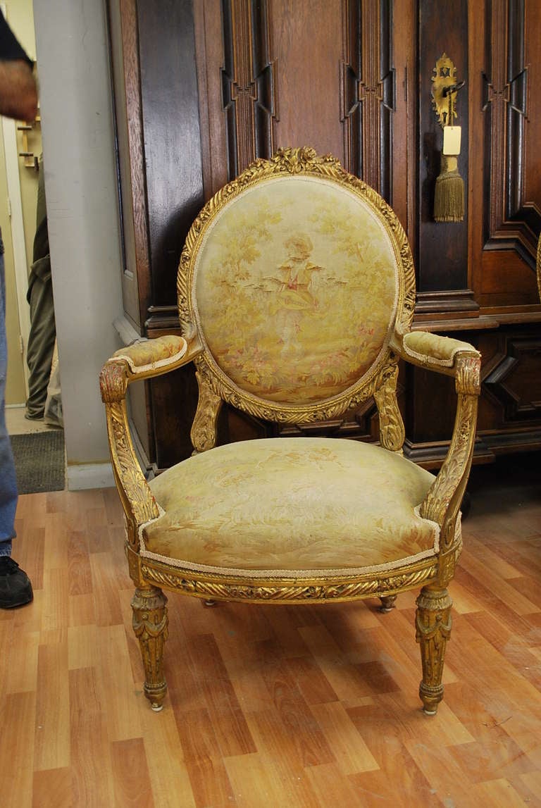 Set of four french gilded wood & nedllepoint Louis XVI Style Fauteuils In Good Condition In West Palm Beach, FL