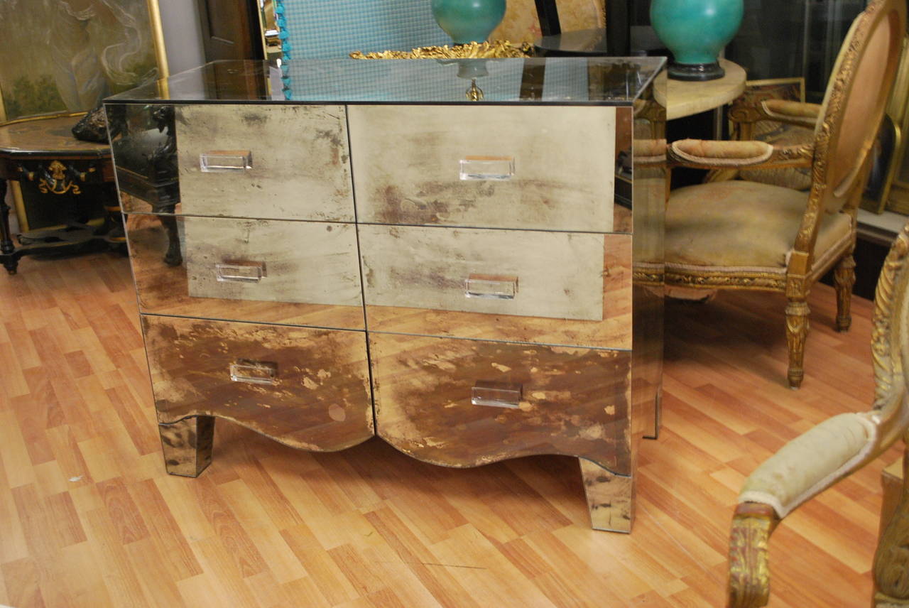 Very stylish mirrored dresser fitted with large drawers and Lucite pulls.