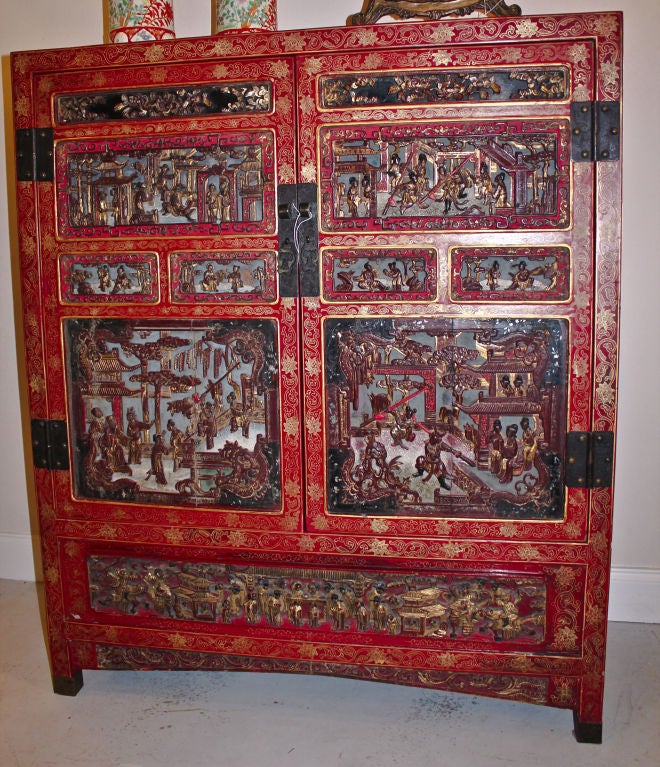 CHINESE CABINET, LAQUERED CARVED AND GILDED