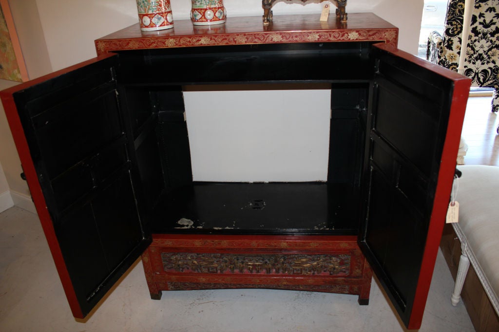 CHINESE CABINET, LAQUERED CARVED AND GILDED 1