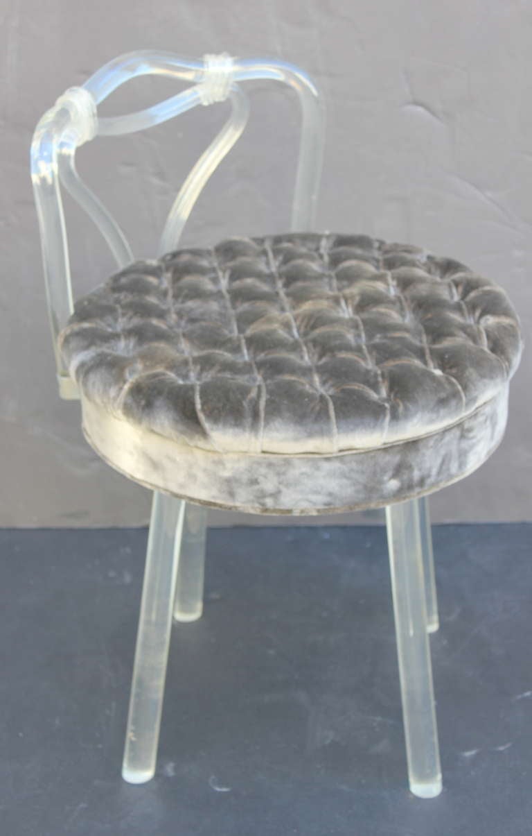 Lucite swivel vanity stool upholstered in silk velvet.