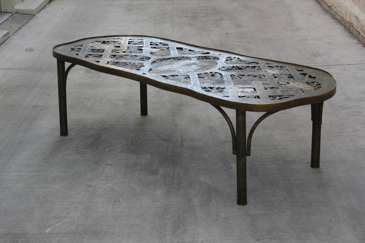 Unusual LaVerne Table with cut out Lacework in Bronze depicting Tree Branches and Roots and Asian Figures. Inset Glass. Signed.