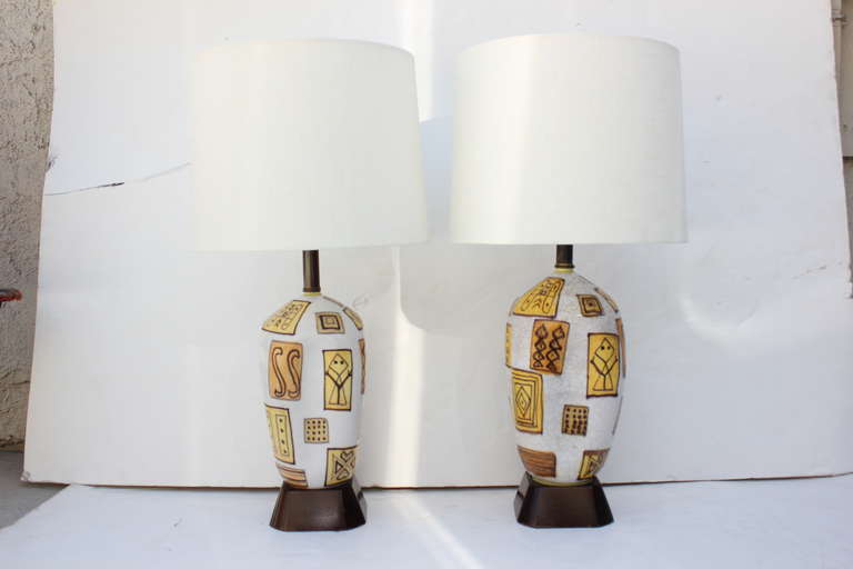 Odd Pair of Gambone Lamps.  Guido Gambone table lamps.  Rewired with double cluster and silk cord.  One body slightly smaller than the other.  Lamp with adjustable double cluster are the same height.