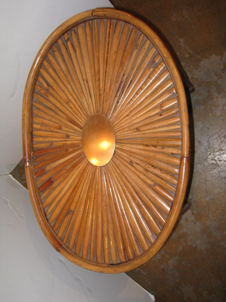 Bamboo and brass tray table. Tray and table are separate.

Brass medallion on top. Brass signature plate on bottom of tray.