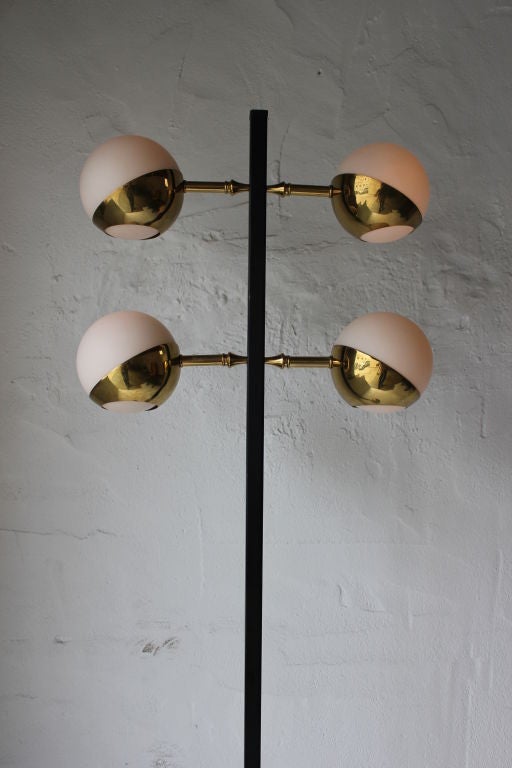 Stilnovo 4 Light Floor lamp in Brass and Black Metal. Great Floor Switch to the Base. All Original. Newly Wired.