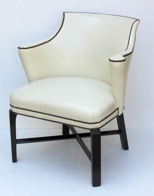 Pair of Syrie Maugham Arm Chairs upholstered in leather  with nail head detail.
