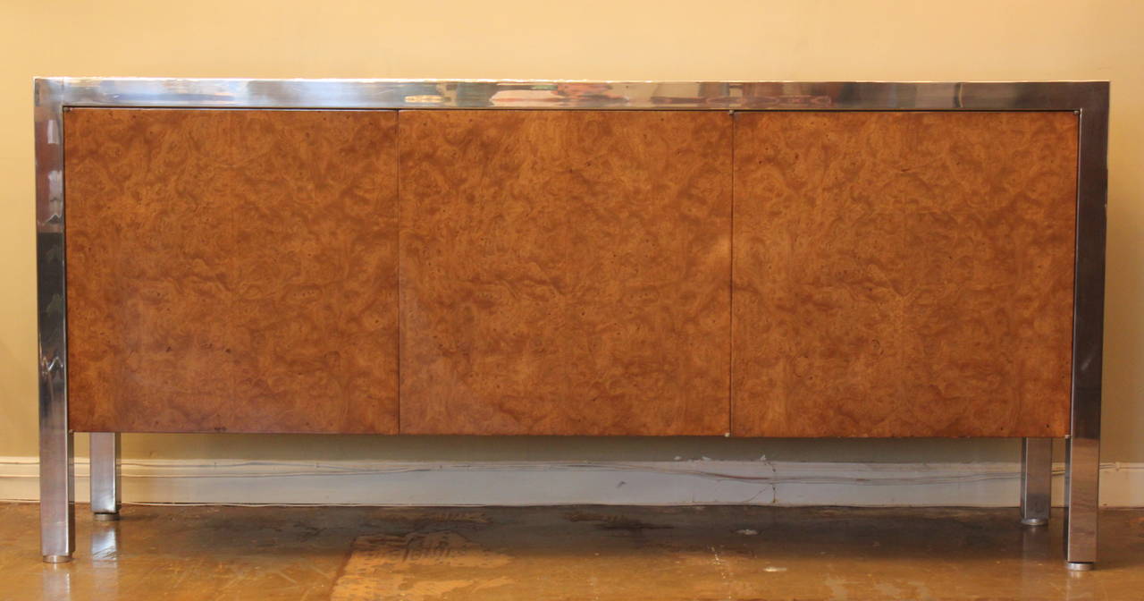Burl walnut and stainless steel cabinet with three doors. Two doors conceal open shelf and one conceals a drawer and open shelf. Designed by Leon Rosen for Pace Collection, 1970s.