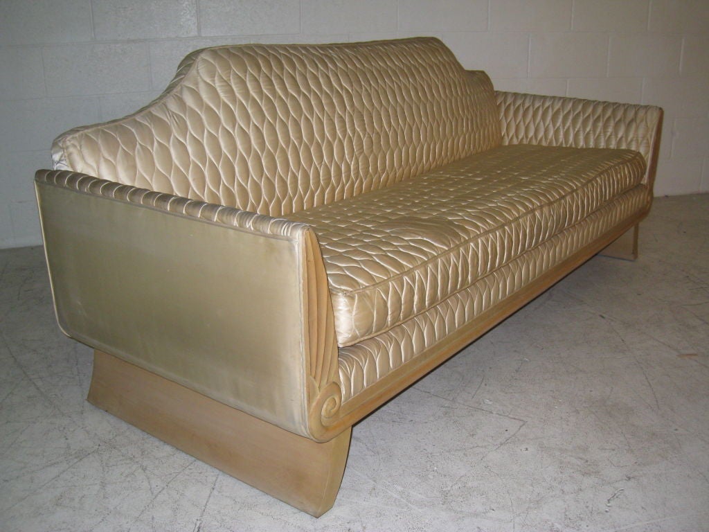 Carved custom sycamore canapé by T.H. Robsjohn-Gibbings. The design of this sofa dates to the time Robsjohn-Gibbings was collaborating with Los Angeles based Architect James Dolena and Design firm Peterson Studios on his most famous commission the
