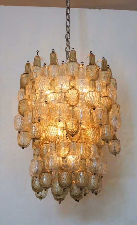 Seguso Murano Chandelier in Two Colors. Clear and Pale Amber/Smoke Color.  Alternating Clear and Amber in Vertical Columns.  Newly rewired and the frame repainted.