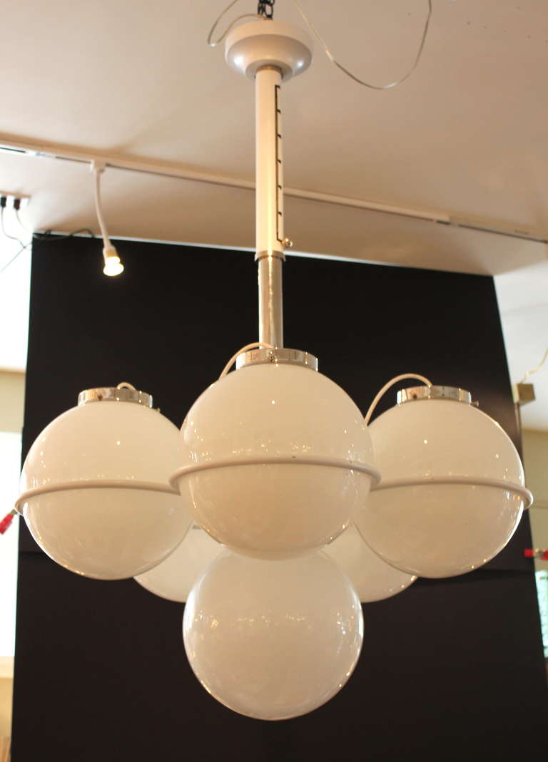 Large Italian Chandelier in the manner of Gino Sartaffi 
Original White powdercoated finish. Original glass globes.
Chrome detail. 
The height adjusts from 40