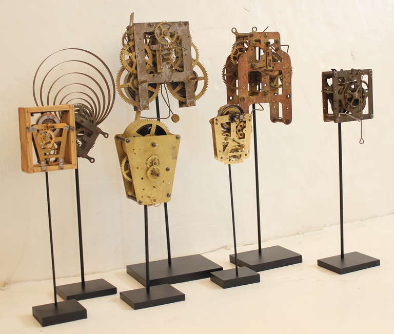 Unknown Collection of Seven Clock Skeletons mounted on Stands