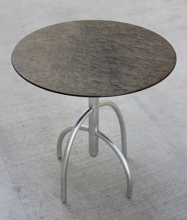 Designed by Lawrence Laske for Knoll in 1993.   The Saguaro Cactus table came with options for the top surface .  This table has a birch burl top in a charcoal grey stain.   The legs are polished Aluminum.  Signed with manufacturers metal tag.