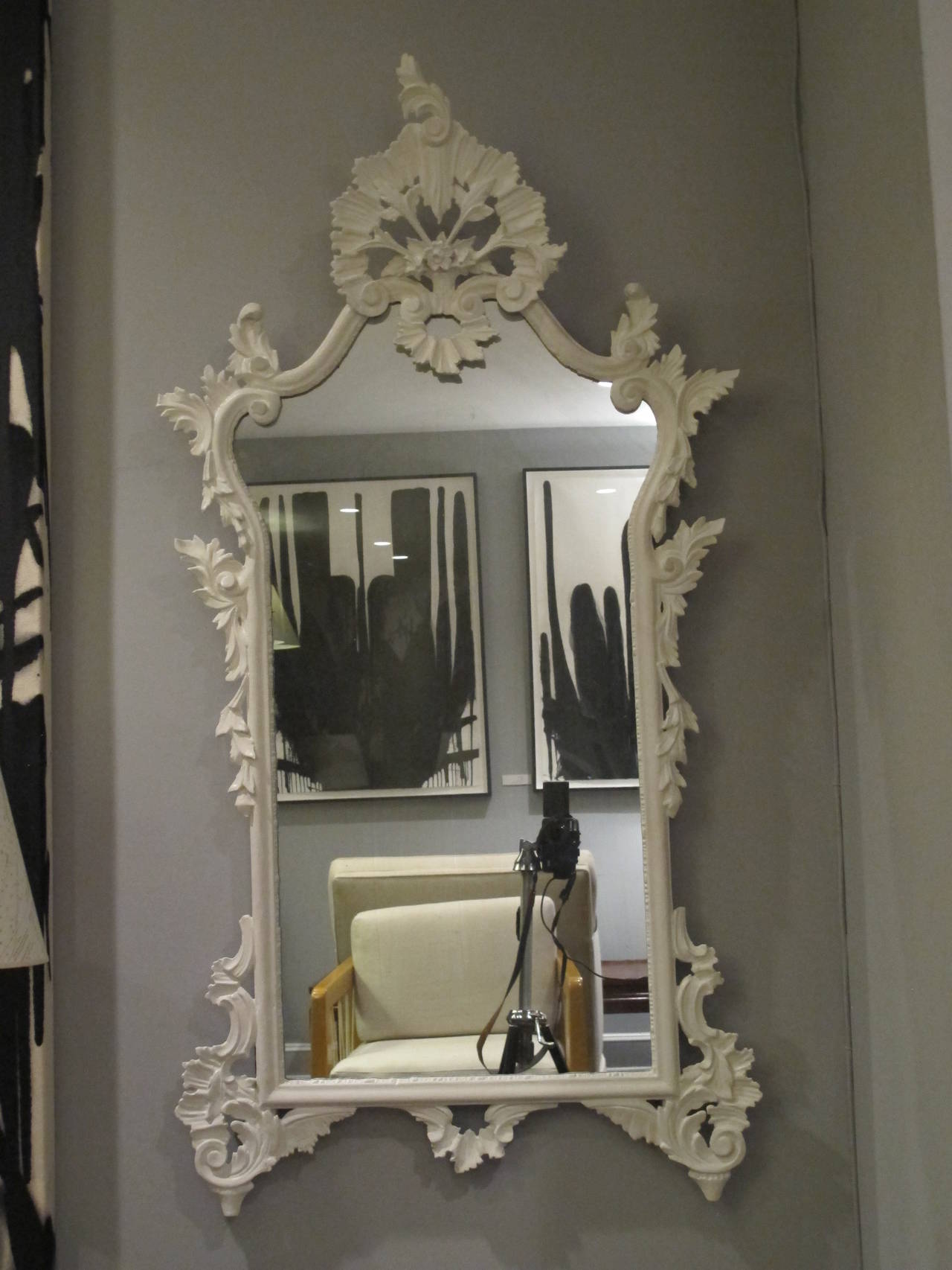 Pale ivory painted over gesso and carved hardwood. Newly repainted. Dimension below are overall, the actual mirror area measures 14.25
